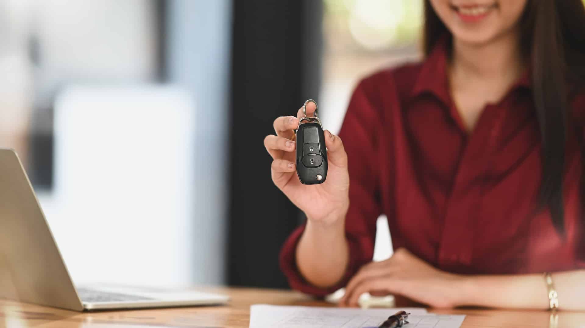 Woman with a car key