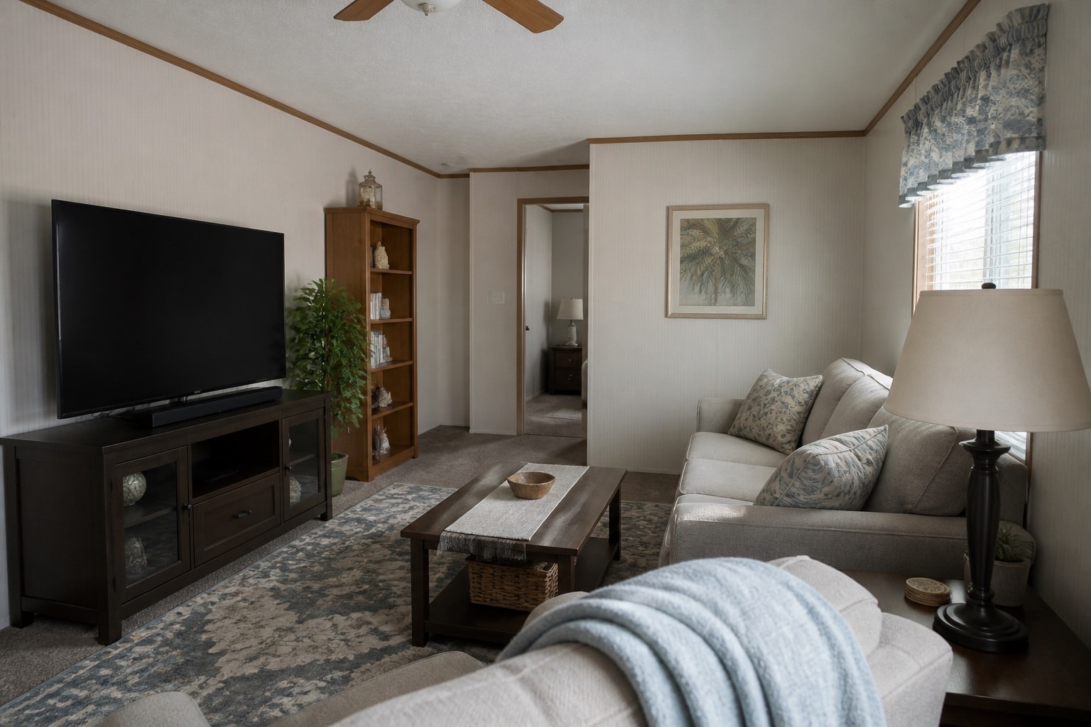 Living room and personal belongings inside a Florida manufactured home